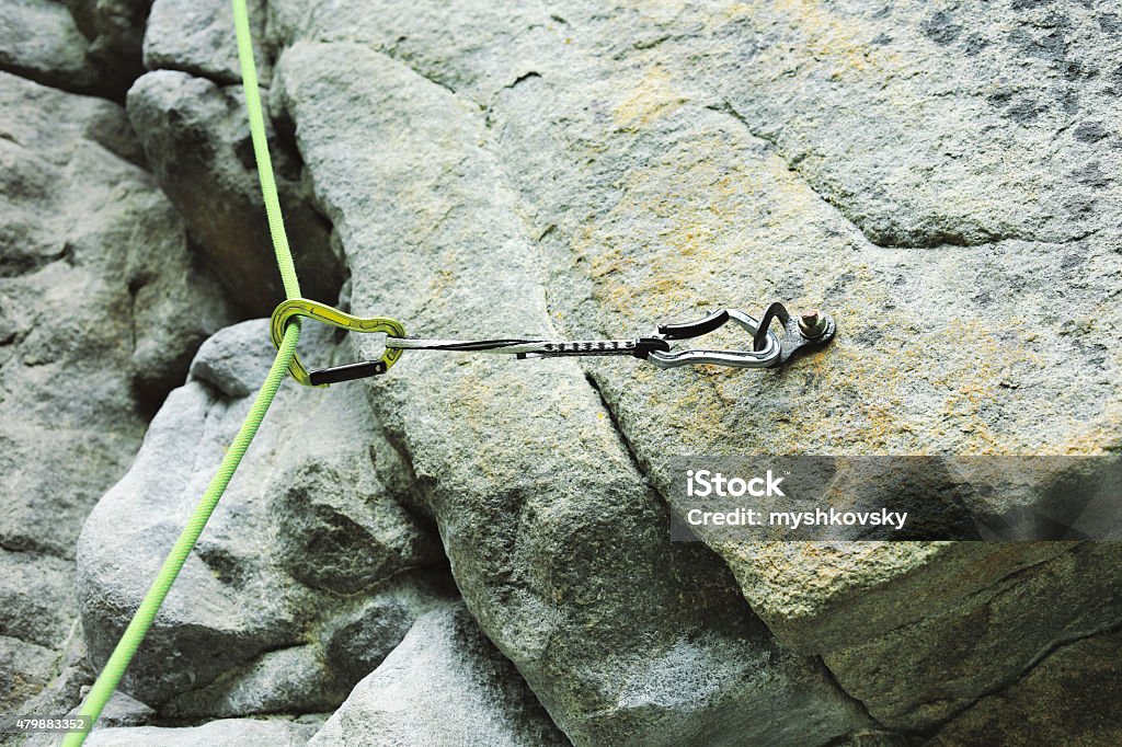 Climbing quickdraw on a rock Close-up of сlimbing quickdraw on a rock. 2015 Stock Photo