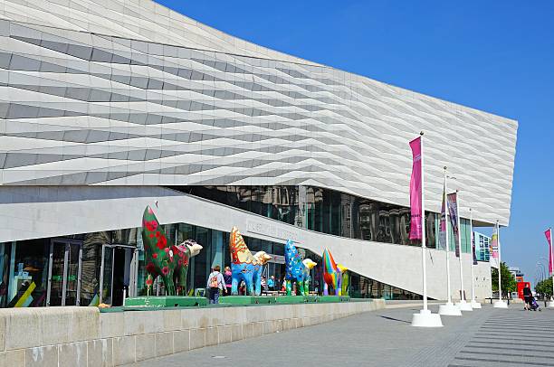 The Museum of Liverpool. Liverpool, United Kingdom - June 11, 2015: The Museum of Liverpool building at Pier Head with four Superlambananas in the foreground and tourists enjoying the sights, Liverpool, Merseyside, England, UK, Western Europe. superlambanana sculpture in liverpool stock pictures, royalty-free photos & images