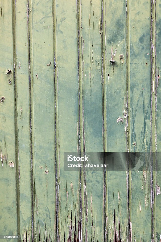 faded green planks of old wooden door faded green vertcal planks of old wooden door 2015 Stock Photo