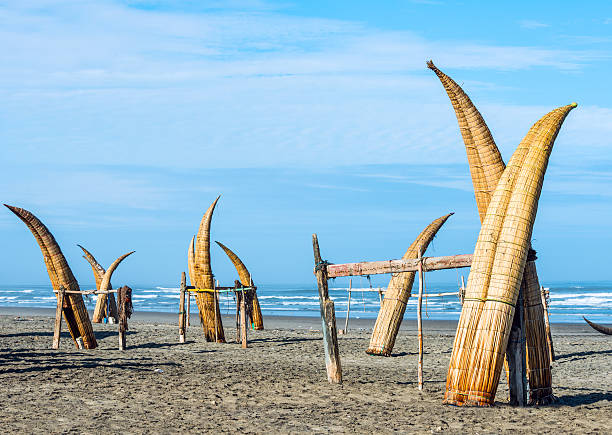Traditional Peruvian small Reed Boats Traditional Peruvian small Reed Boats (Caballitos de Totora), straw boats still used by local fishermens in Peru trujillo peru stock pictures, royalty-free photos & images