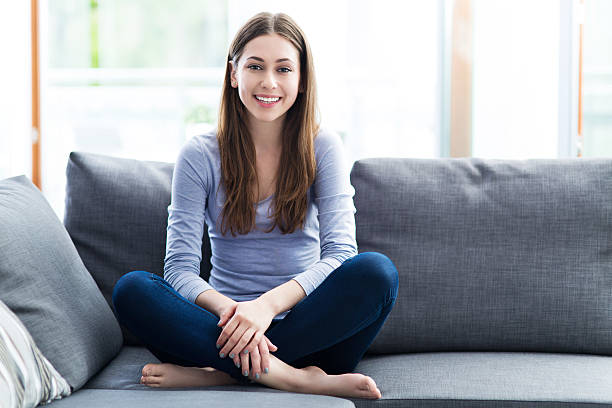 istock Woman sitting on sofa 479888486