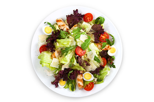 Mix salad with chicken, cherry tomato, parmesan cheese and eggs.