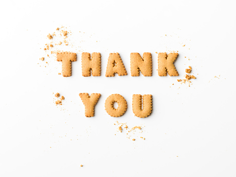 thank you message written with letter biscuits, on white background