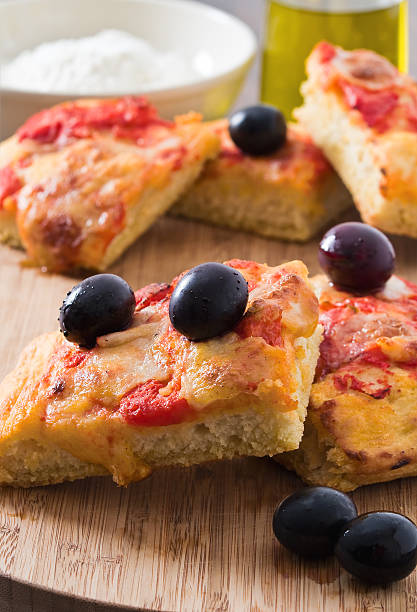 istock Focaccia with tomato and black olives. 479893538