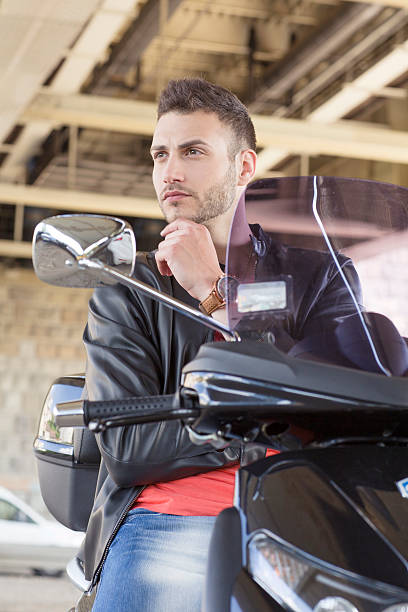 istock Handsome young man on vespa 479894426