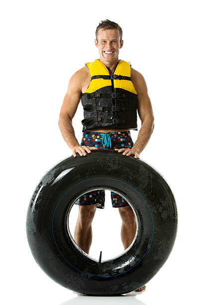 istock Smiling man holding inner tube 479896684