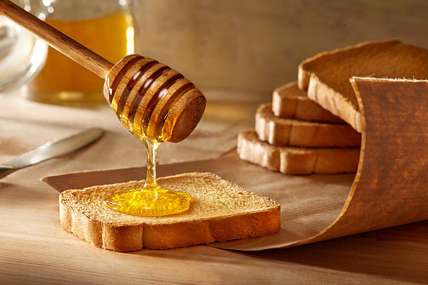 istock Honey poured over a rusk slice 479897676