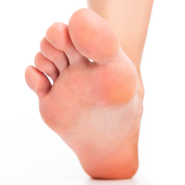 Foot stepping on white stock photo