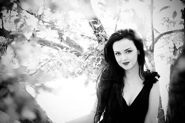 istock Beautiful young woman with flowers 479900126