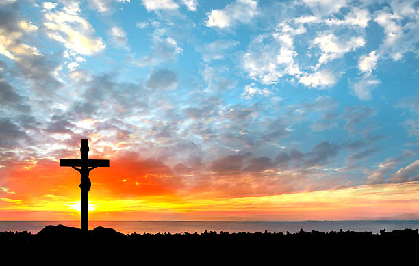 istock Silhouette Jesus and the cross over sunset 479903478