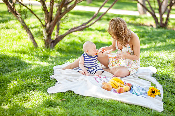 picture of happy baby with mother enjoying nature