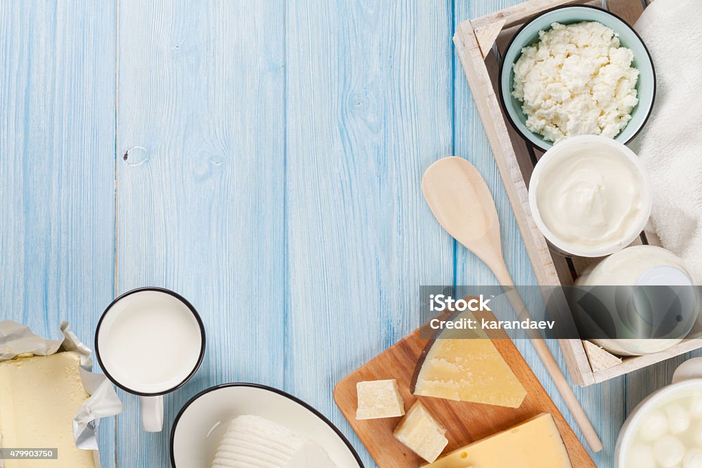 Dairy products. Sour cream, milk, cheese, egg, yogurt and butter Dairy products on wooden table. Sour cream, milk, cheese, egg, yogurt and butter. Top view with copy space Dairy Product Stock Photo