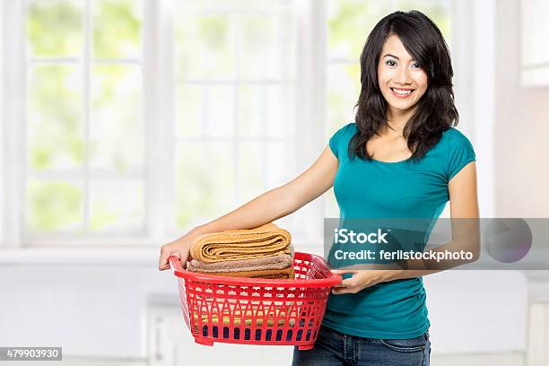 Woman With Laundry Stock Photo - Download Image Now - 2015, Adult, Adults Only