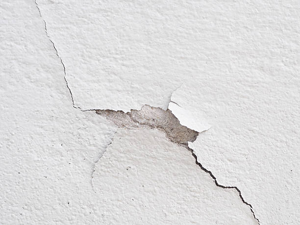istock Color coat and concrete cement wall with crack. 479905542