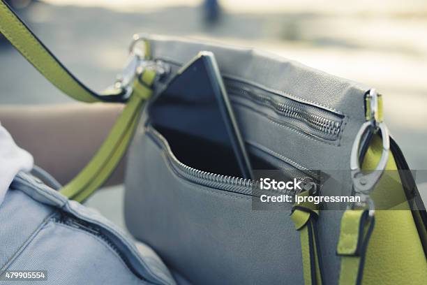 Womens Handbag With The Phone On The Street Close Up Stock Photo - Download Image Now