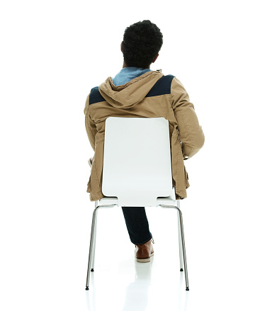Rear view of casual man sitting on chairhttp://www.twodozendesign.info/i/1.png