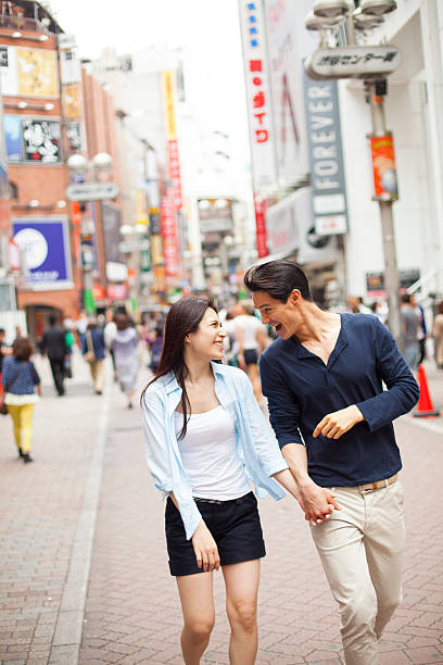 istock Young couple against cityscape background 479909448