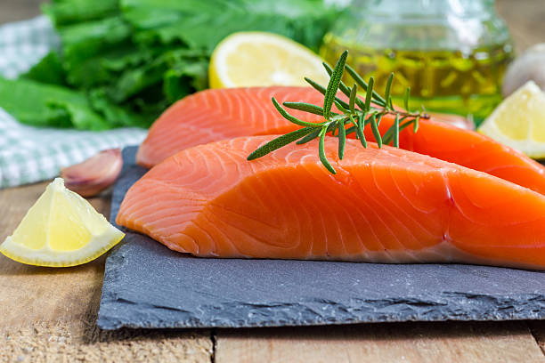 istock Fresh raw salmon fillet with rosemary and lemon 479920626