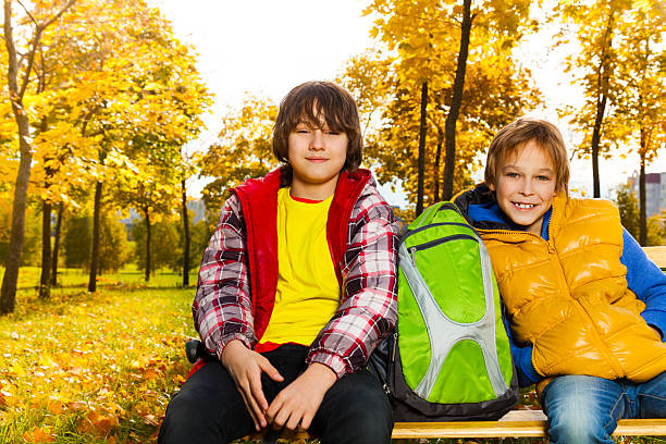 istock Two boys in park after school 479921087