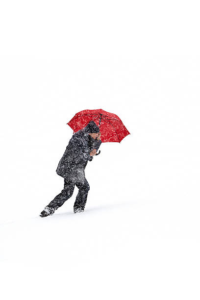 istock Man snow red umbrella hill 479921146