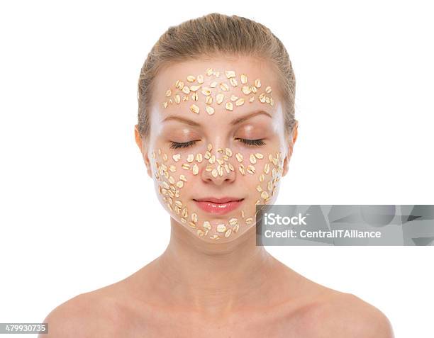 Portrait Of Relaxed Young Woman Making Oatmeal Mask Stock Photo - Download Image Now