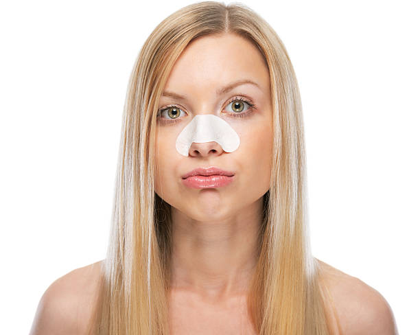 istock concerned young woman with clear-up strips on nose 479931257