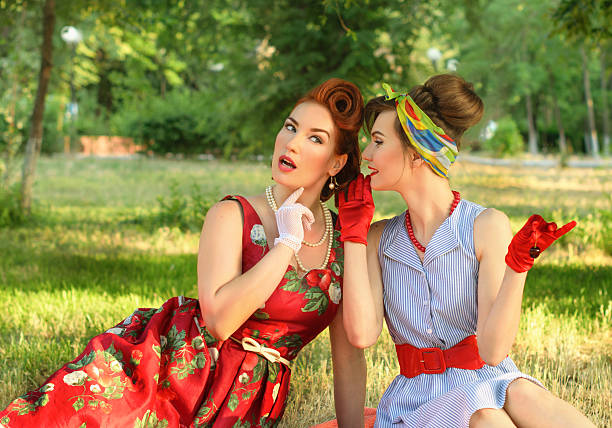 istock two girls gossiping 479932312