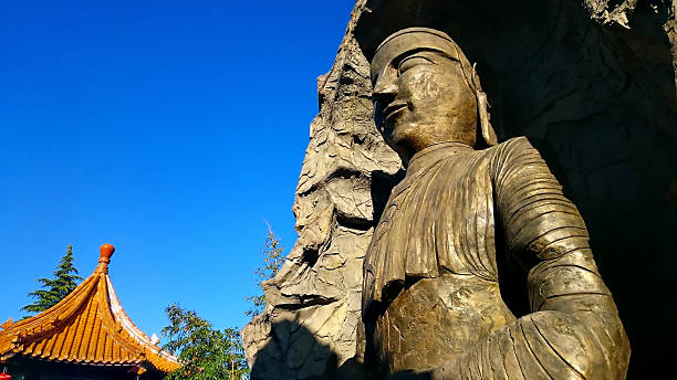 istock Buddah statue and chinese roof 479934964