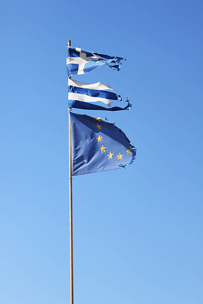 rasgado bandera griega y rasgado unión europea bandera en fondo azul - euro symbol crisis time debt fotografías e imágenes de stock