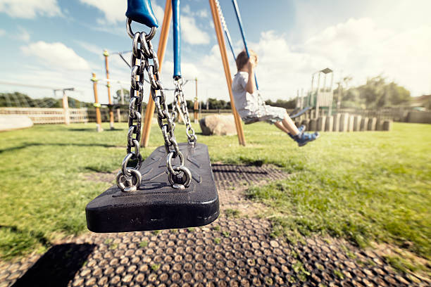 balanço vazio parque infantil - swing playground empty abandoned imagens e fotografias de stock