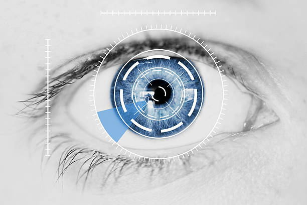 Security Retina Scanner on Blue Human Eye Abstract Security Iris or Retina Scanner being used on an Intense Macro Blue Human Eye, with Limited Palette blue eyes stock pictures, royalty-free photos & images