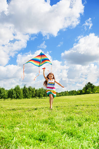istock Girl with kite 479940219