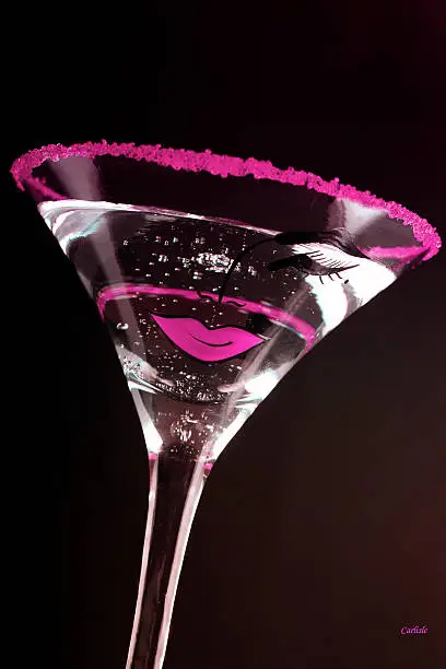 Cocktail glass with purple kiss on the glass.