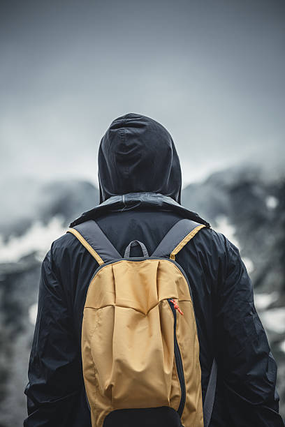 istock Traveler with backpack walking in a misty mountains 479945232