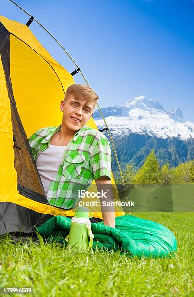 Young Man On Sleeping Bag Stock Photo - Download Image Now - Activity, Adult, Adults Only
