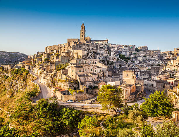 Ancient town of Matera at sunrise, Basilicata, Italy Ancient town of Matera (Sassi di Matera) at sunrise, Basilicata, southern Italy. matera stock pictures, royalty-free photos & images