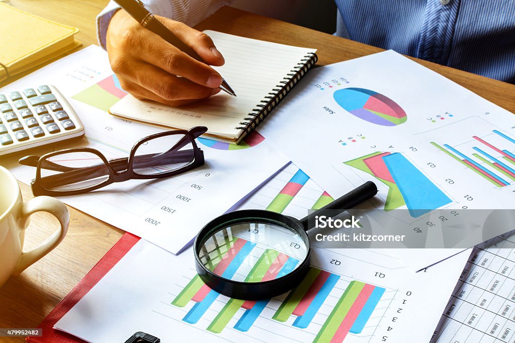 Desk office business financial accounting calculate, Graph analy businessman working on Desk office business financial accounting calculate, Graph analysis 2015 Stock Photo