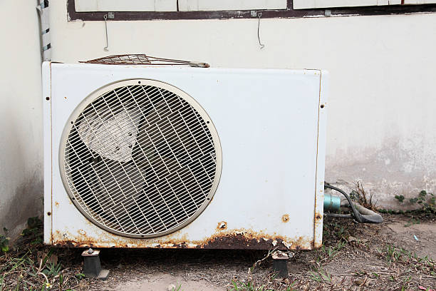 istock Old air compressors is located behind the building. 479954601