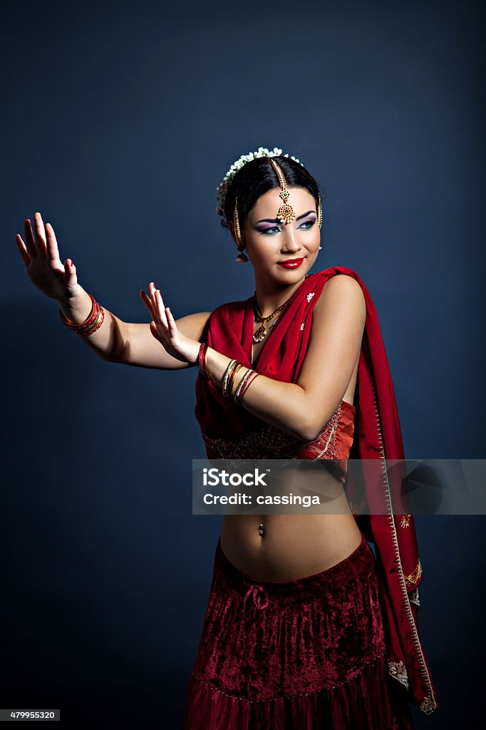 Beautiful young dancing woman in traditional indian clothing Beautiful young woman in traditional indian clothing dancing 2015 Stock Photo