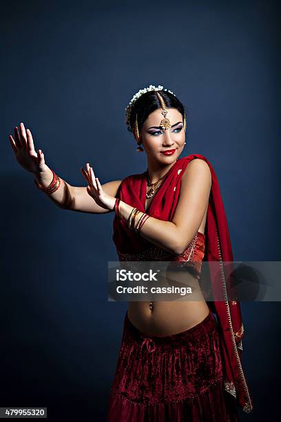 Beautiful Young Dancing Woman In Traditional Indian Clothing Stock Photo - Download Image Now