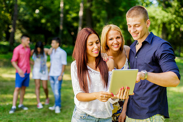 istock Teenagers in the park with tablet 479955647