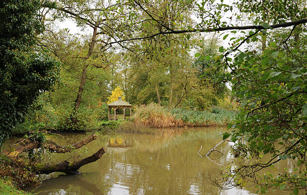 Lake at Coughton Court, Warwickshire, England, UK View Across the Lake at Coughton Court in Warwickshire, England, UK coughton stock pictures, royalty-free photos & images