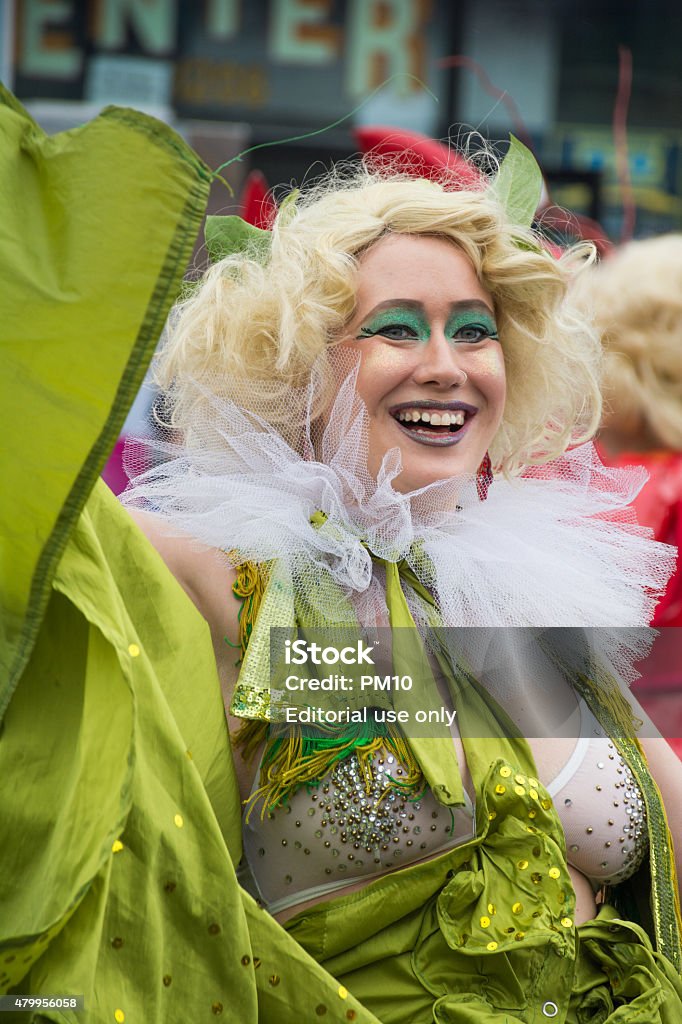 Woman at mermaid parade in coney island New York City, USA - June 20, 2015: Woman flaunts her costume as the Mermaid parade in Coney Island, New York city. The Mermaid Parade is the largest art parade in the nation. A celebration of ancient mythology and honky-tonk rituals of the seaside, it showcases over 3,000 creative individuals. 2015 Stock Photo