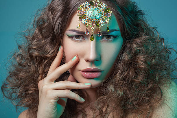 istock Beautiful woman with elegant gold middle eastern headpiece on head 479959658