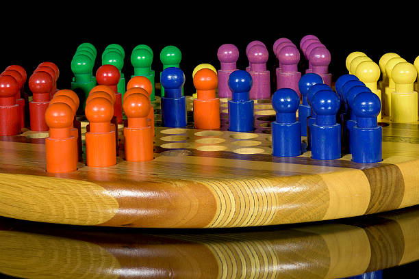 istock Colorful pegs in a Chinese Checkers board 479961652