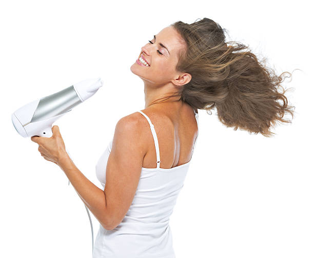 istock happy young woman blow-dry 479964779