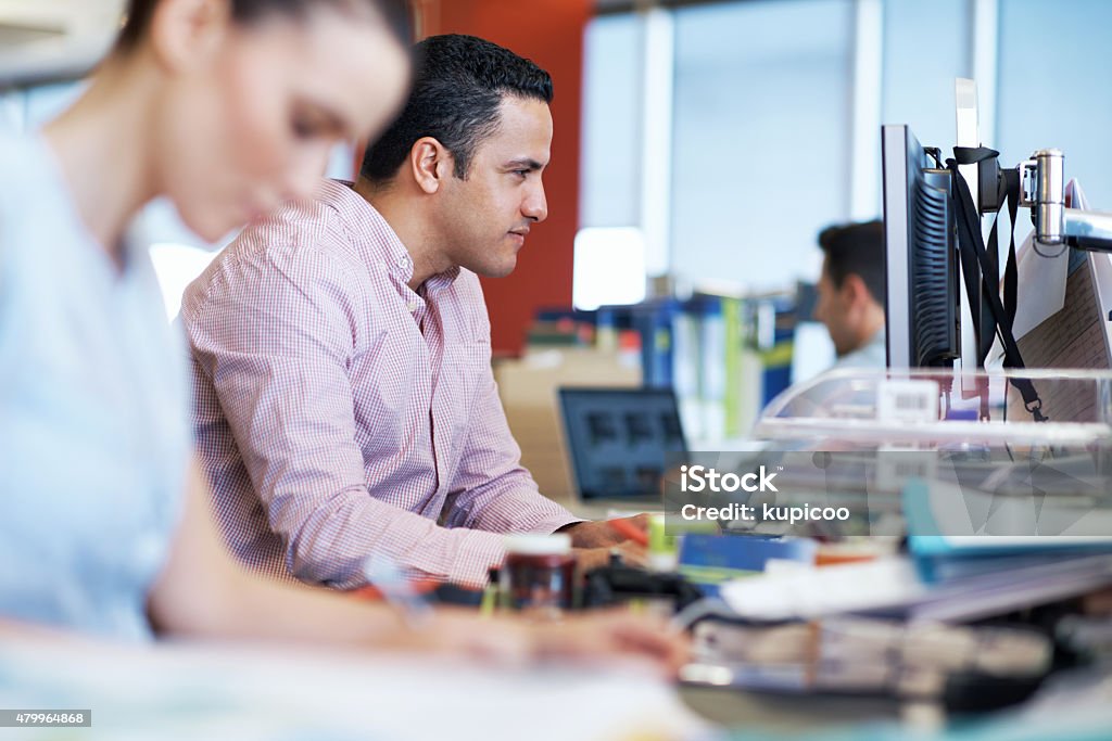The project has their one-hundred percent focus Shot of a people working at their desks in an office 2015 Stock Photo