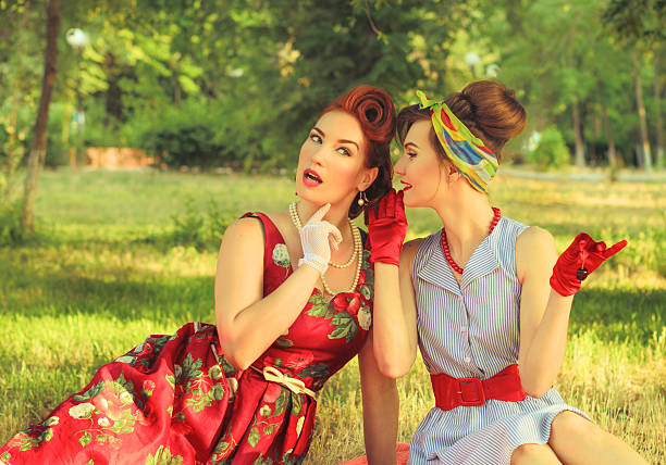 istock two girls gossiping 479965268
