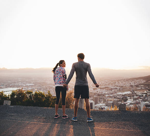 istock Joggers standing on hillside in morning 479966096