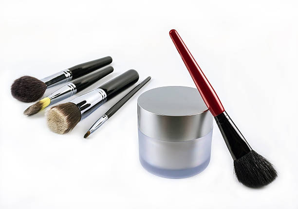 istock professional makeup brush and a jar of cream 479972292